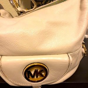 Michael Kors handbag and wallet, leather cream colored